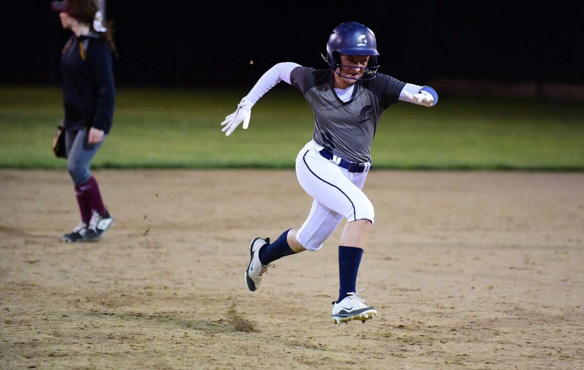 Stone Ridge Christian sophomore Sydney Shaw sprints to third base after a throw skips into center field during the Knights’ 4-1 win over Forest Hill Christian on Tuesday, May 21, 2019 in Stockton, Calif.