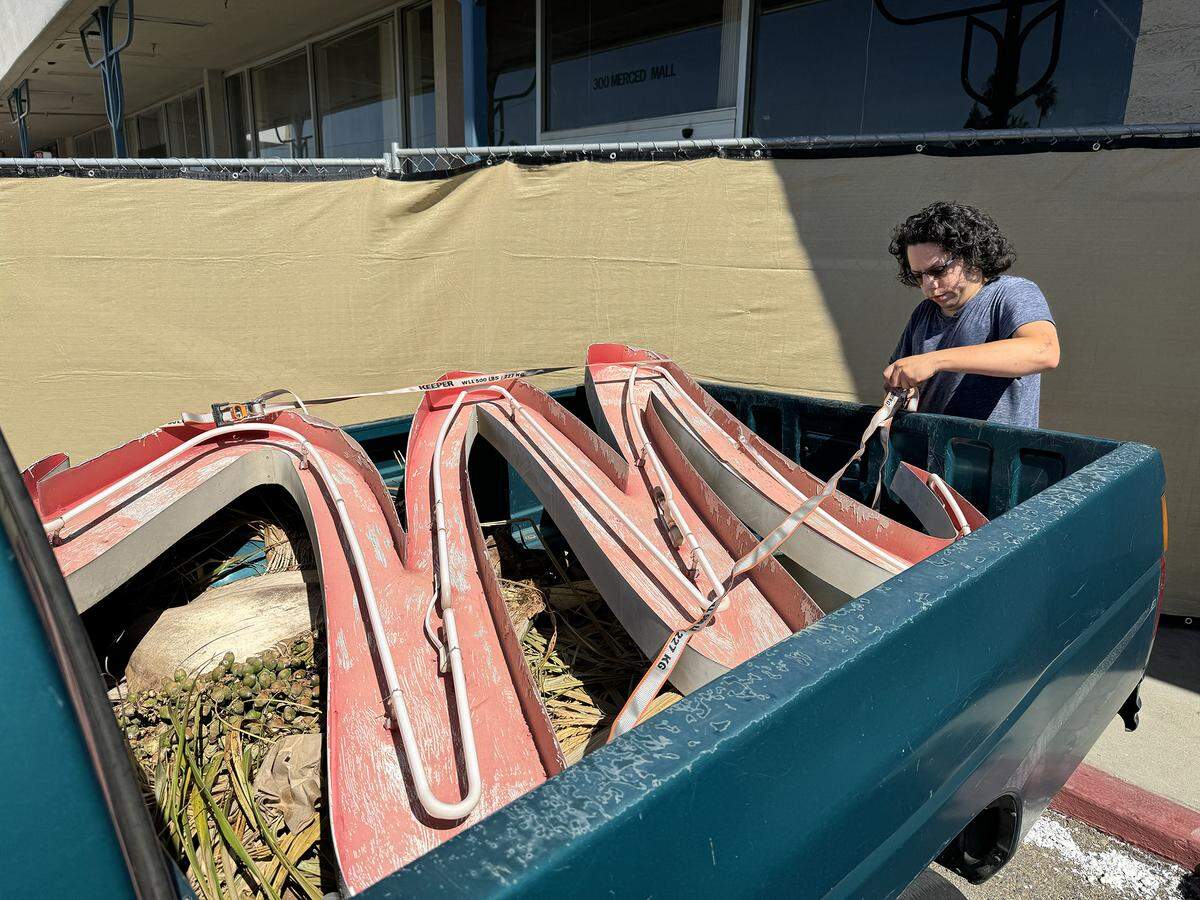 Part of the former Merced Mall neon sign is loaded up for transport to the Merced County Courthouse Museum after it was removed from an entrance to the mall in Merced, Calif. in July 2025. Image courtesy of William S. George. 
