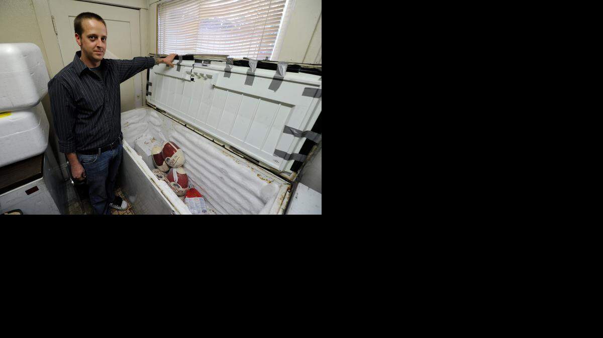  Rescue mission disciple and chef Tim Adam  shows the mission’s empty freezer at its Merced location in 2013. 
