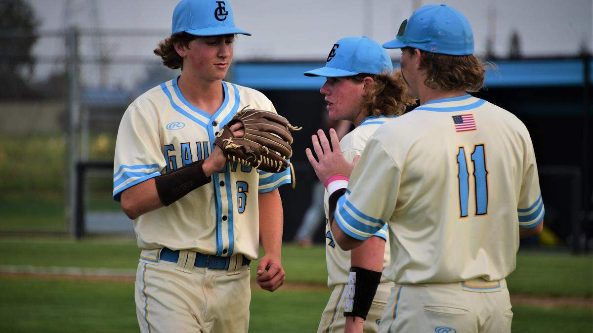 El Capitan High junior Andrew Bakken (left) is congratulated by teammates after getting the final out of a 2-0 win over Merced on Wednesday, March 30, 2022 at El Capitan High School.
