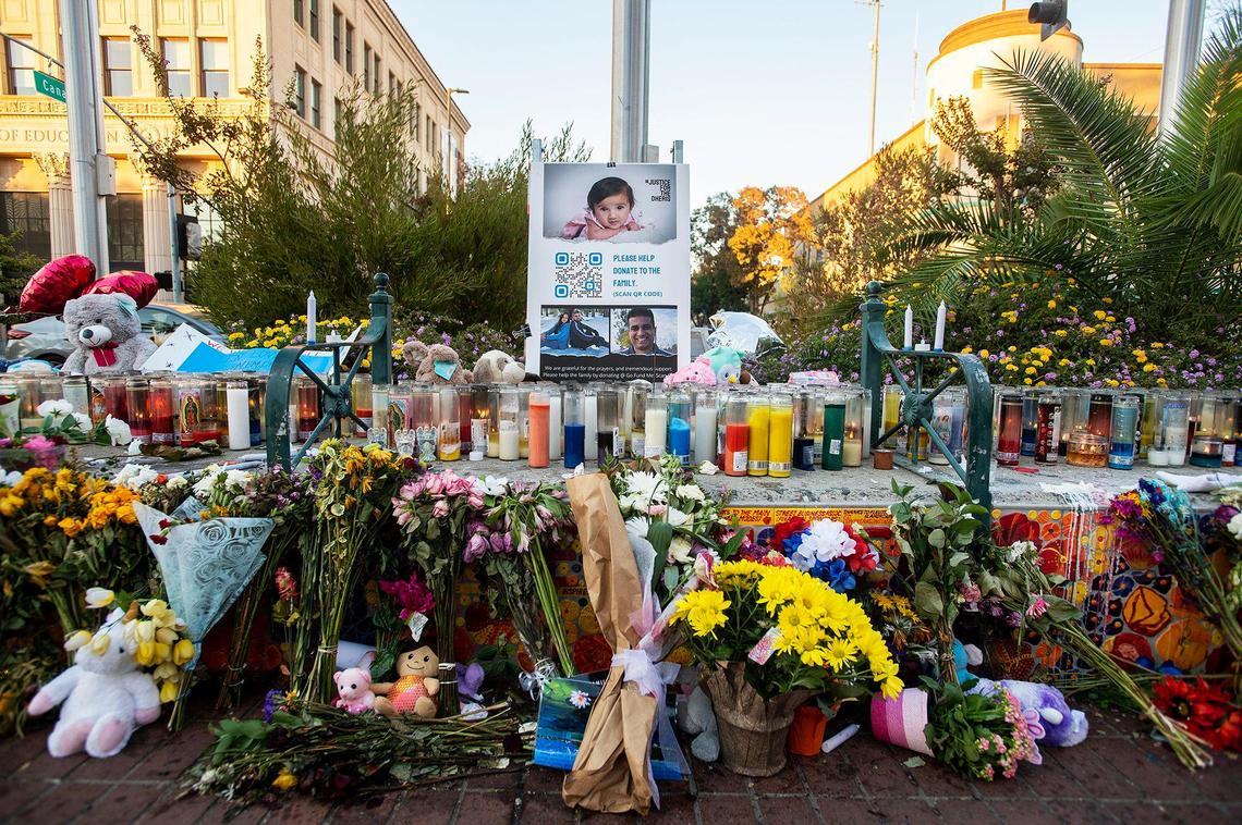 Flowers and candles placed at a memorial for 8-month-old Aroohi Dheri, her parents Jasleen Kaur, 27, and Jasdeep Singh, 36, and her uncle Amandeep Singh, 39, at Bob Hart Square in Merced, Calif., on Sunday, Oct. 9, 2022. All four kidnapping victims were found dead in a rural area of Merced County north of Dos Palos on Oct. 5. Authorities said the family was kidnapped at gunpoint from a Merced County business on Oct. 3.