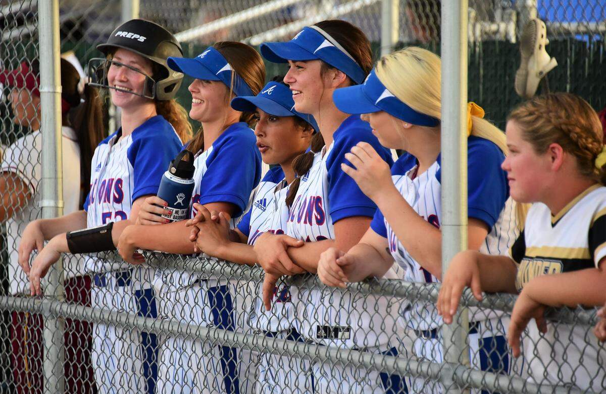 Five Atwater players enjoy a moment in the dugout as they watch the Central California Conference all-stars play during the fifth annual Paul Leonardo Memorial All-Star Game on Tuesday, June 11, 2019 at the Livingston Softball Complex.