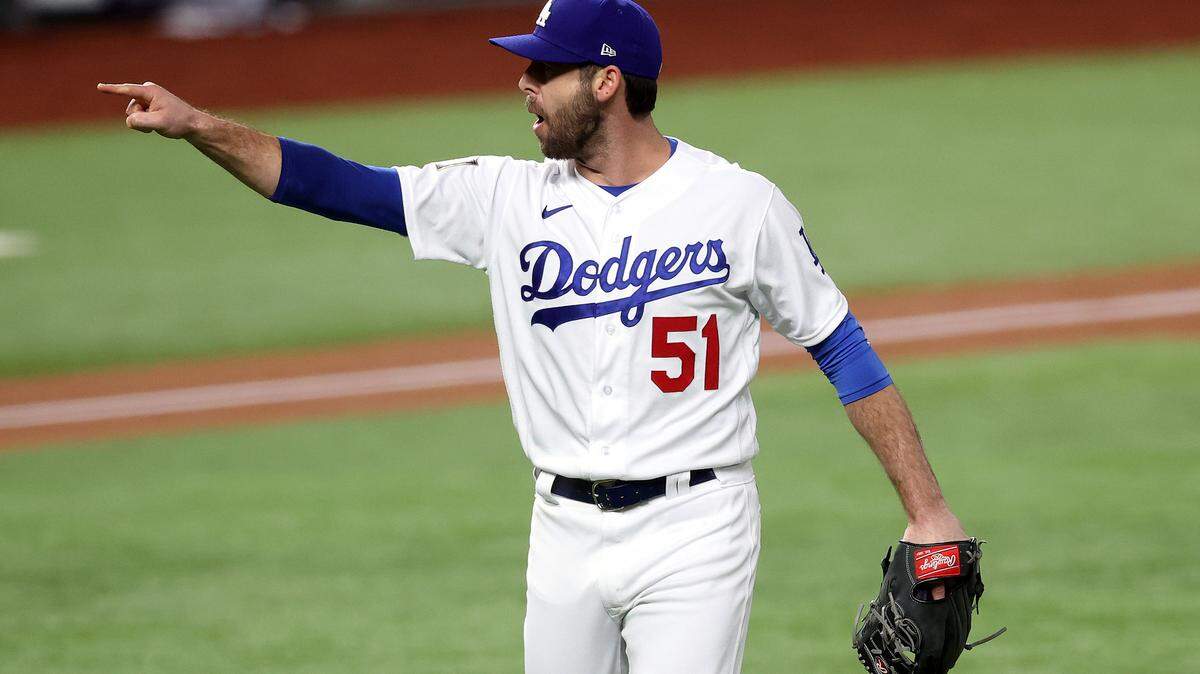 ARLINGTON, TEXAS - OCTOBER 27: Dylan Floro #51 of the Los Angeles Dodgers celebrates after striking out Randy Arozarena (not pictured) of the Tampa Bay Rays to end the top of the second inning in Game Six of the 2020 MLB World Series at Globe Life Field on October 27, 2020 in Arlington, Texas. (Photo by Tom Pennington/Getty Images)