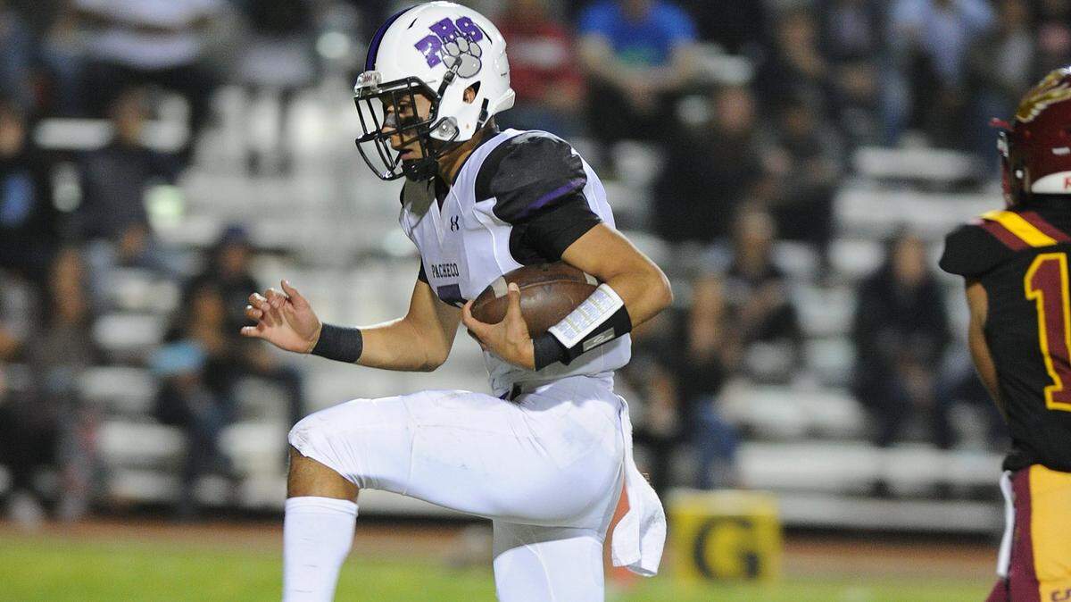 Pacheco High School quarterback Marcus Ordunez scores a touchdown against Los Banos. Ordunez was selected as the Western Athletic Conference Offensive Player of the Year.
