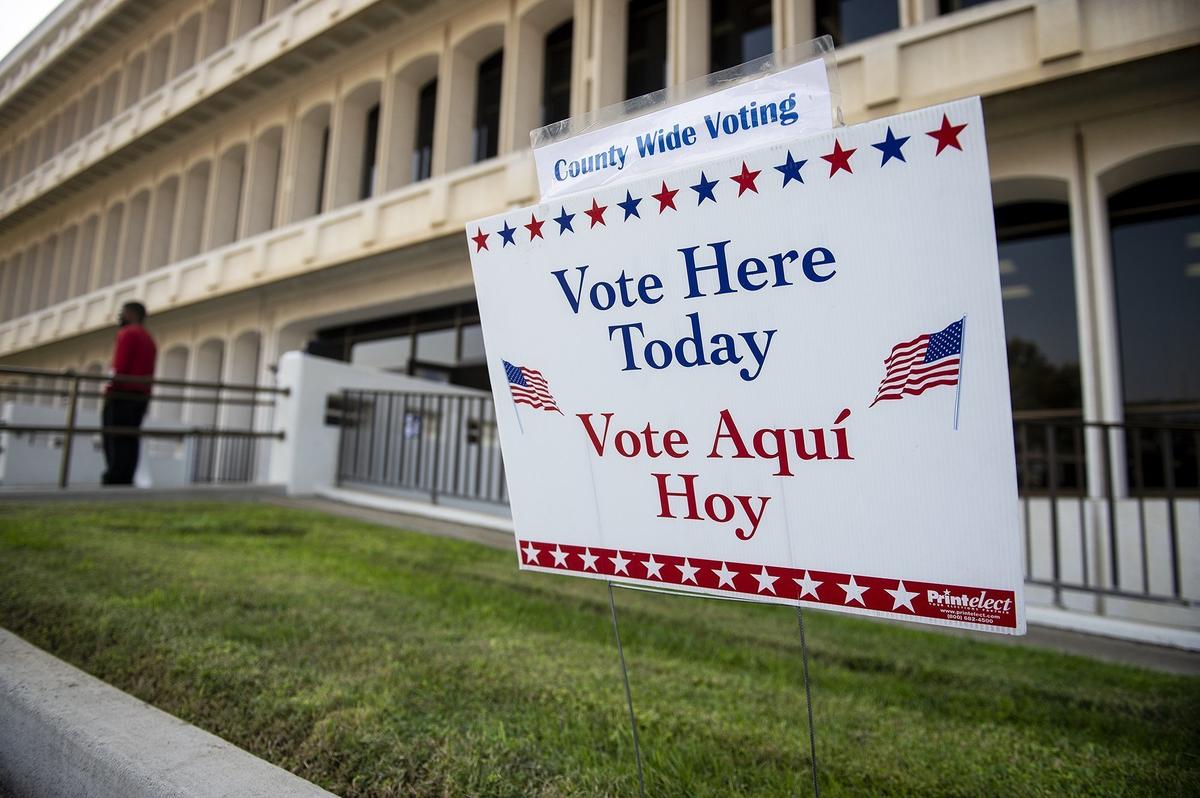 A sign directing people to vote at the location is seen outside the Merced County Building on M Street in Merced, Calif., on Tuesday, Nov. 3, 2020.