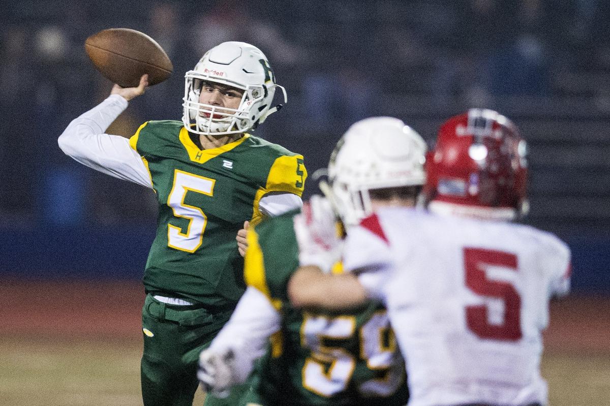 Hilmar junior quarterback Treven Crowley (5) drops back to pass during the Northern California 6-AA Championship game against East Nicolaus at Atwater High School in Atwater, Calif., on Friday, Dec. 7, 2018. The Yellowjackets beat the Spartans 48-14.