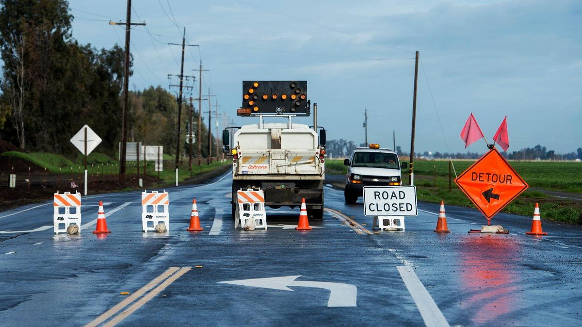 The California Department of Transportation closes a section of Highway 59 at the intersection of Sandy Mush Road in rural Merced County, Calif., on Thursday, Jan. 19, 2017. Caltrans announced Wednesday, March 13, 2019, that multiple projects are planned to improve the safety and conditions on roads in Merced County.