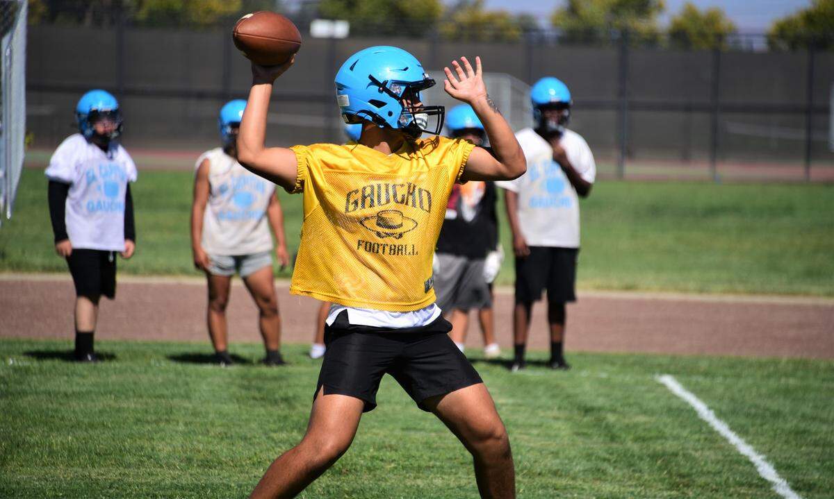 El Capitan High School senior quarterback Ceaser Manzo throws a pass during practice on Thursday, Aug. 11, 2022.