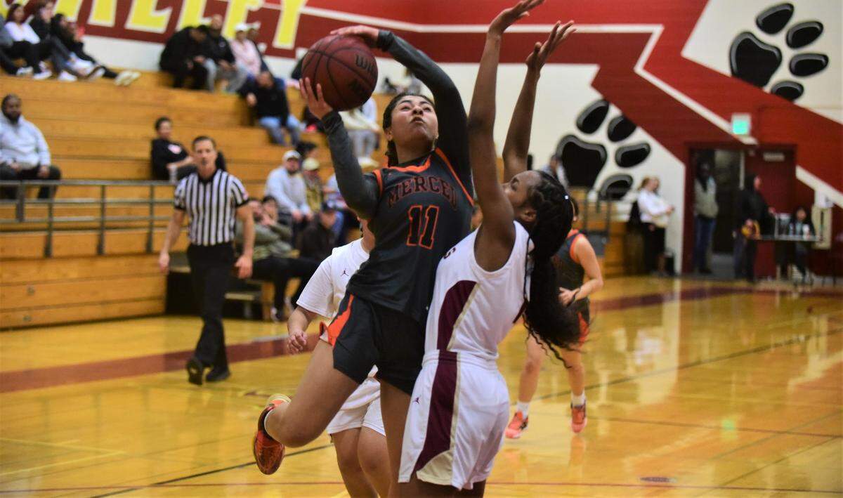 Merced High School senior Mylah Steverson (11)goes up for a shot against Golden Valley’s Zariyah Hughes (1) during a game on Thursday, Jan. 19, 2023 at Cougar Arena.