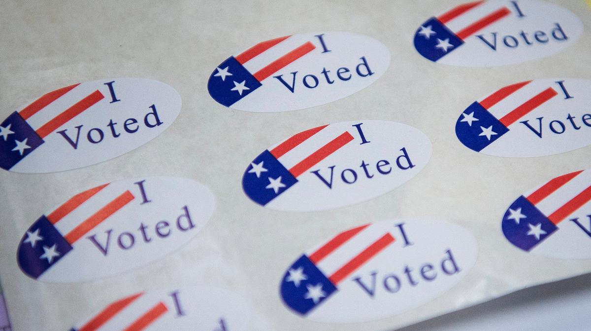 Stickers like these were handed out to voters at a polling location in the Merced County Administrative Building during the March primary election.