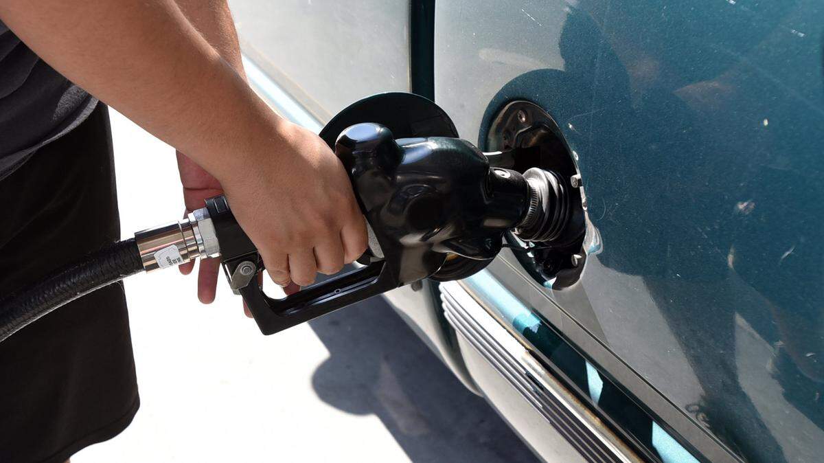 Gabriel Garcia, 25, of Merced pumps gas at Valero station on G Street on Monday, May 2, 2016. The price of gas is expected to rise as Memorial Day draws near.
