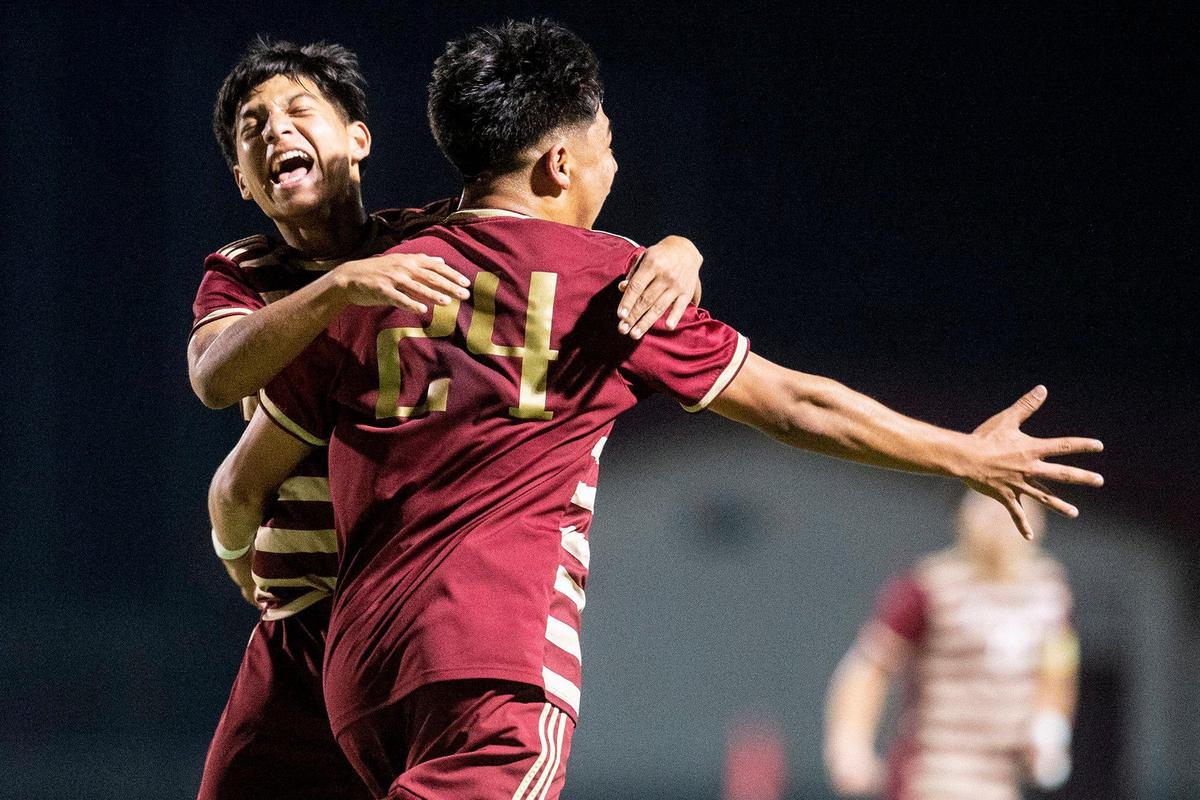 Golden Valley junior Jose Ontiveros (24) and Golden Valley senior Giovanny Ramirez (8) celebrate after Ontiveros scored a goal during a Division 2 playoff game against Rocklin at Golden Valley High School in Merced, Calif., on Tuesday, Feb. 13, 2024. The Cougars beat the Thunder 3-0.
