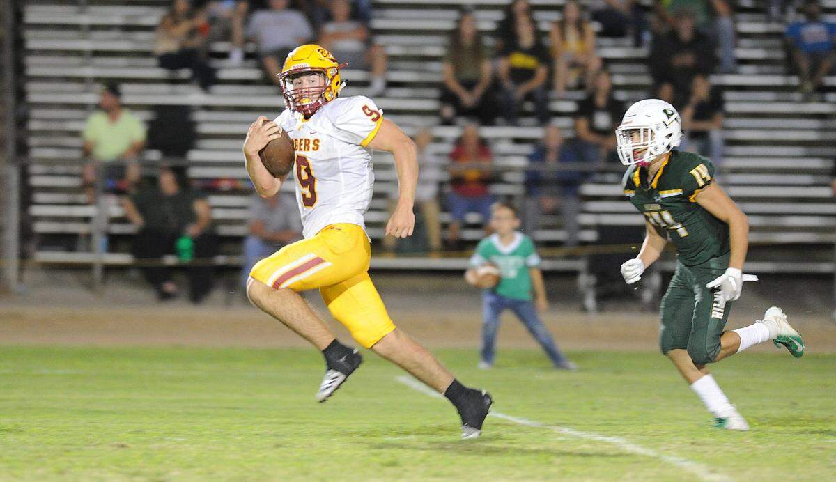 Los Banos High School running back, Justin Incaprera rushes for a 64-yard touchdown in the third quarter Friday night, Aug. 30, 2019 against Hilmar High School.