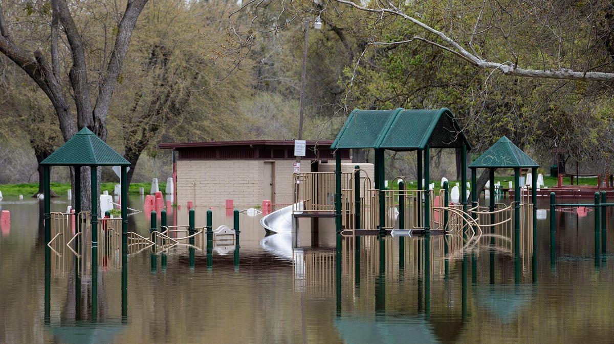 A flooded section of Hagaman Park as the Merced River remains above flood stage in Livingston, Calif., on Sunday, April 2, 2023.
