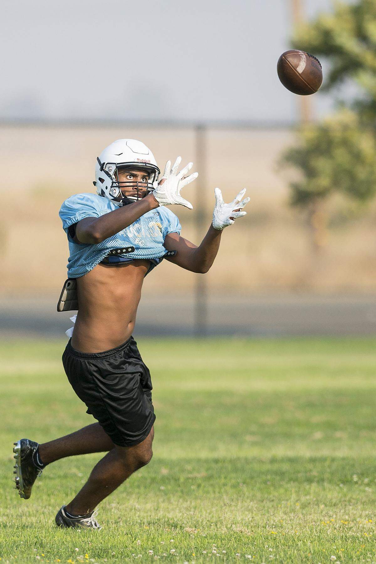 El Capitan’s Ronald Harris catches a pass during football practice at El Capitan High School in Merced, Calif., on Wednesday, Aug. 8, 2018. 