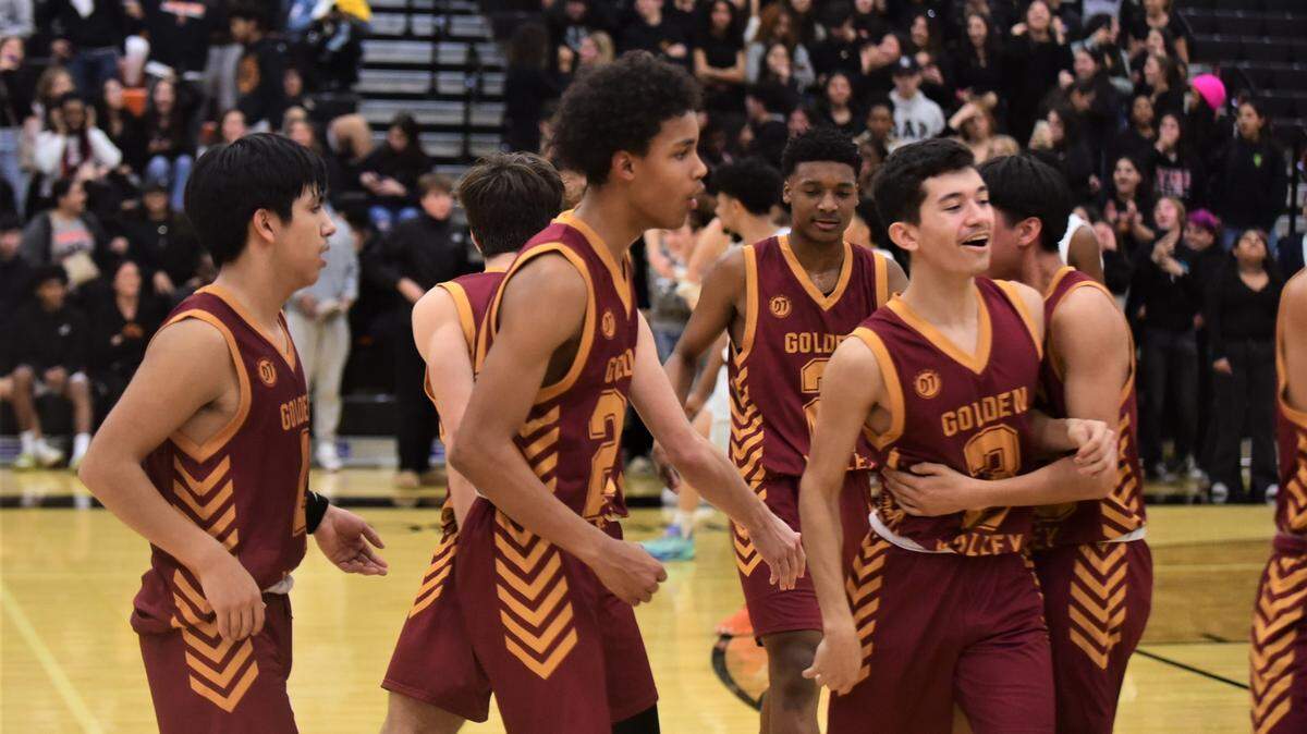 Golden Valley High School players celebrate their 51-48 overtime win over Merced High on Friday, Jan. 20, 2023 at Merced High School.