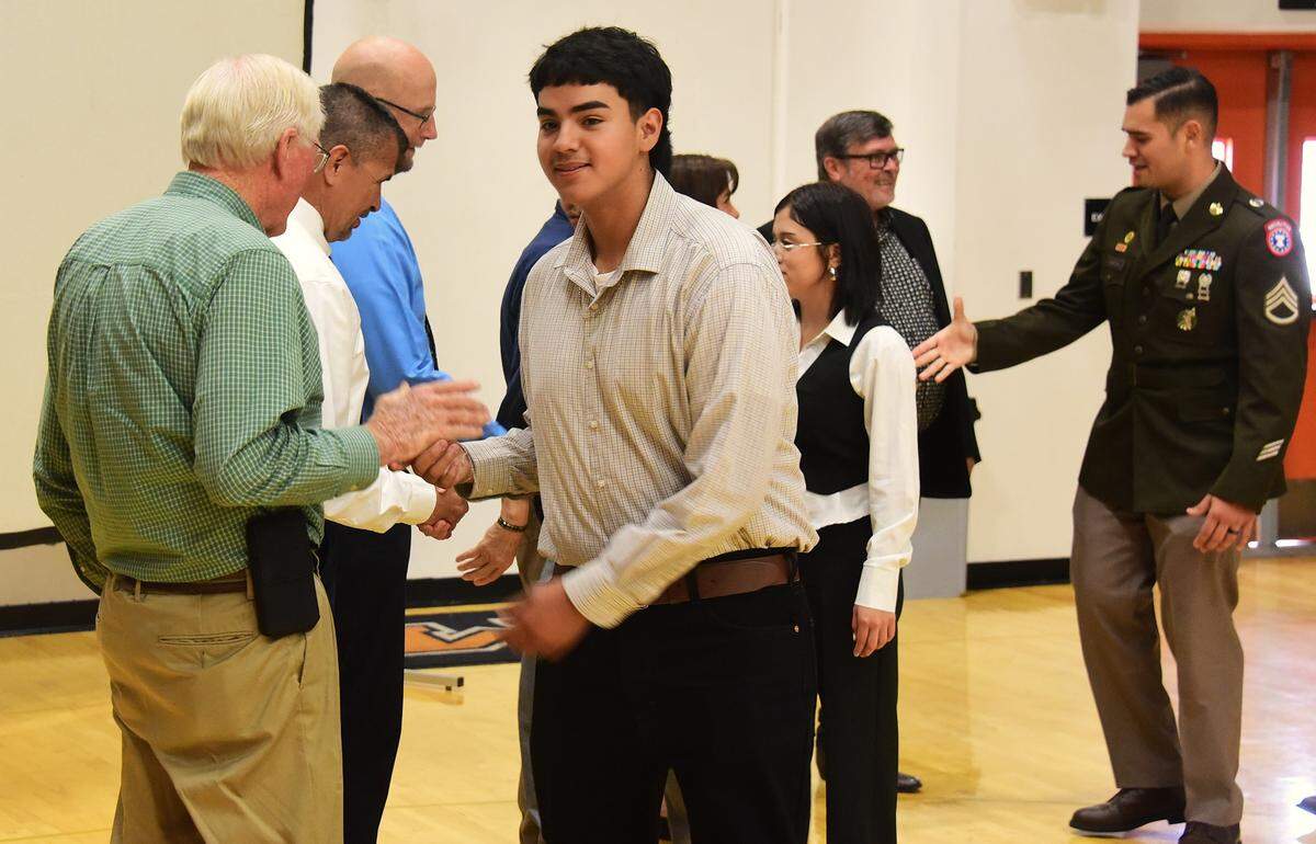 El Capitan High School senior Carlos Vega makes his way to the stage during the Merced Union High School District’s Salute to Service Luncheon on Tuesday, May 13, 2025 at Merced High School.