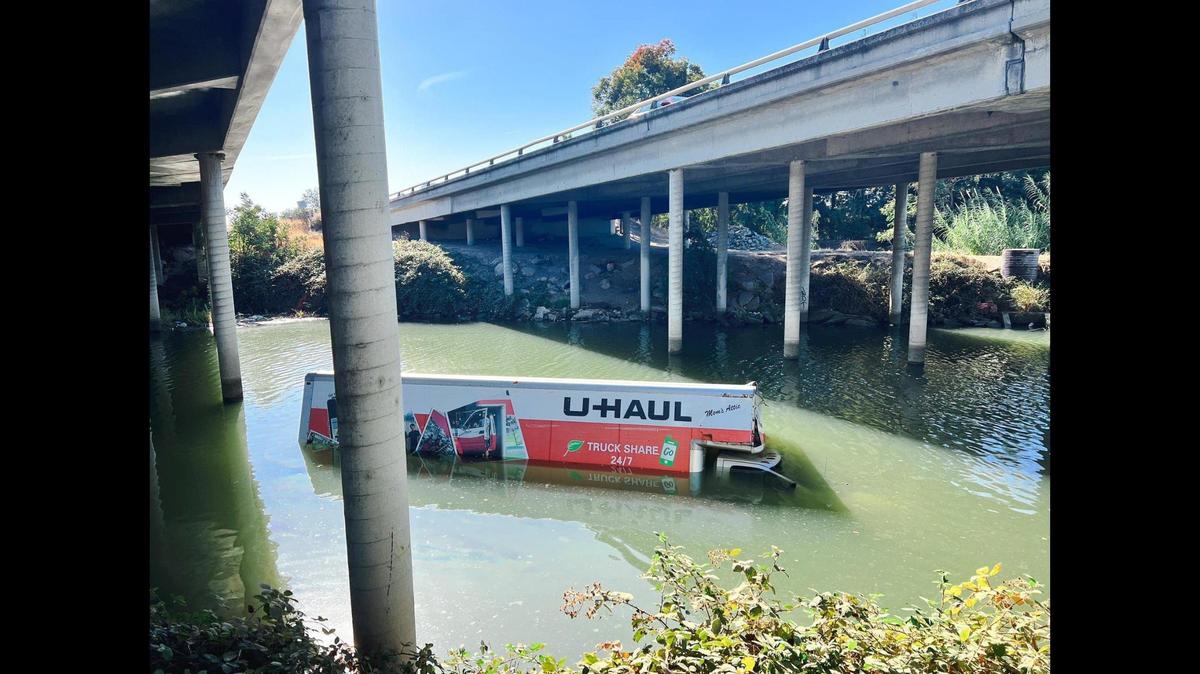 Authorities are looking for the driver a U-Haul truck that crashed into a guardrail along Highway 99 and into Bear Creek in Merced on Saturday, according to the California Highway Patrol. Image Courtesy of Merced County Sheriff’s Office.