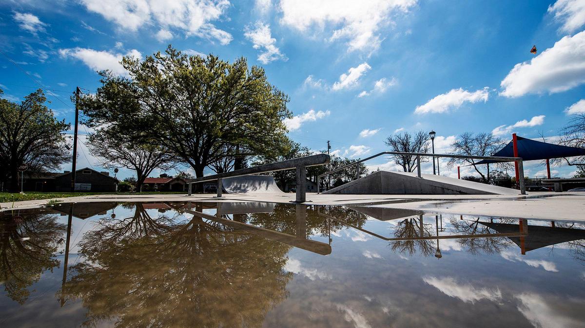 A few large puddles remain at the Stephen Leonard park skate park following morning rain showers in Merced, Calif., on Wednesday, March 11, 2020.