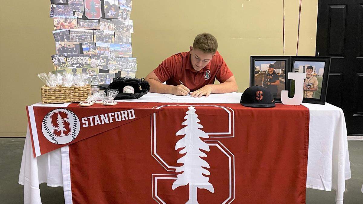 Buhach Colony senior Jake Sapien celebrated his signing his national letter of intent to accept a baseball scholarship to Stanford on Tuesday night at the NorCal Valley Baseball Academy in Modesto, Calif.