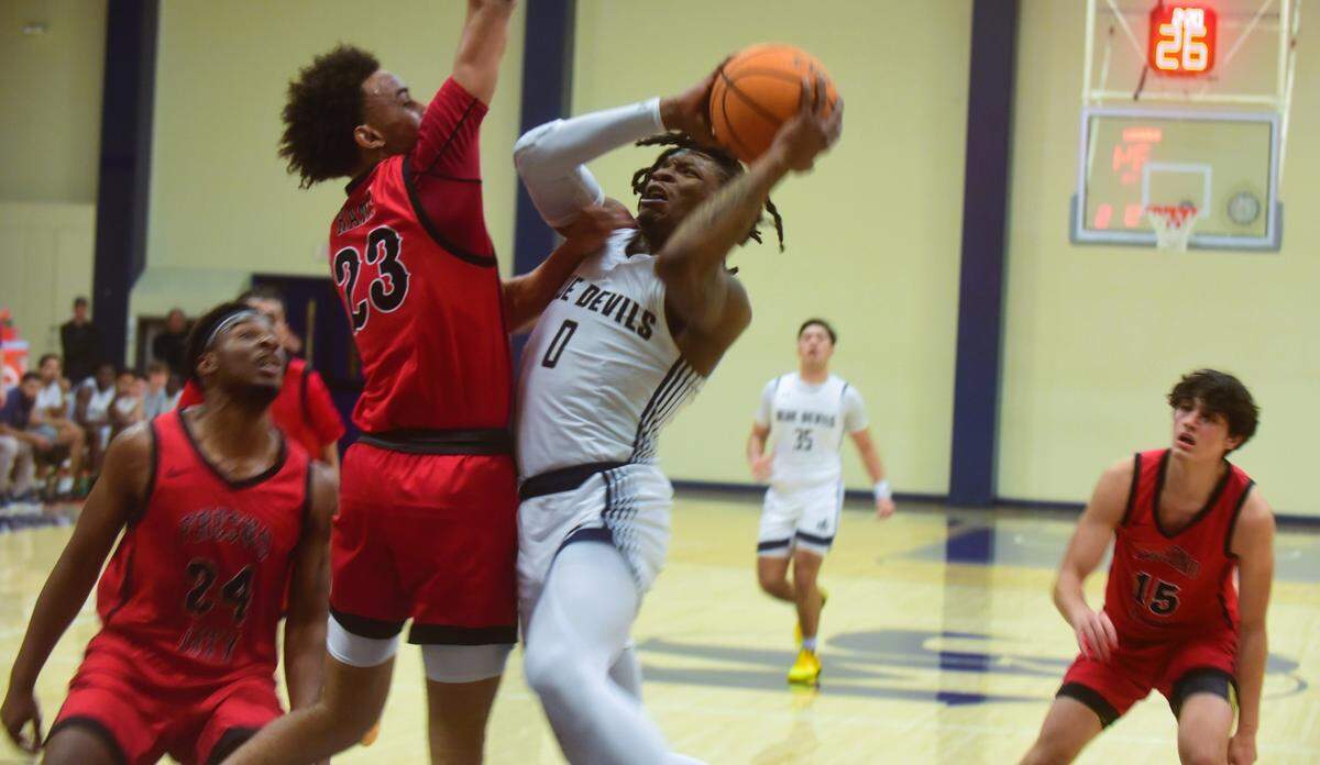 Merced College sophomore Tyreon Payne (0) goes up for a shot during a 124-108 loss to Fresno City on Wednesday, Jan. 10, 2024 at Don Reid Court.
