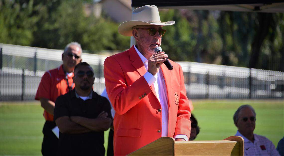 Local developer Greg Hostetler speaks during the ribbon-cutting ceremony for Merced High School’s new on-campus Cathie Hostetler Stadium on Friday, Aug. 12, 2022.