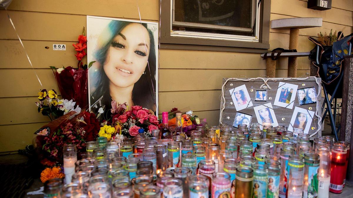 A memorial for 33-year-old Christina Velez is seen on the front porch of her home in Merced, Calif., on Tuesday, Nov. 2, 2021. According to family and friends, Velez was killed in a shooting at the home on Oct. 30.