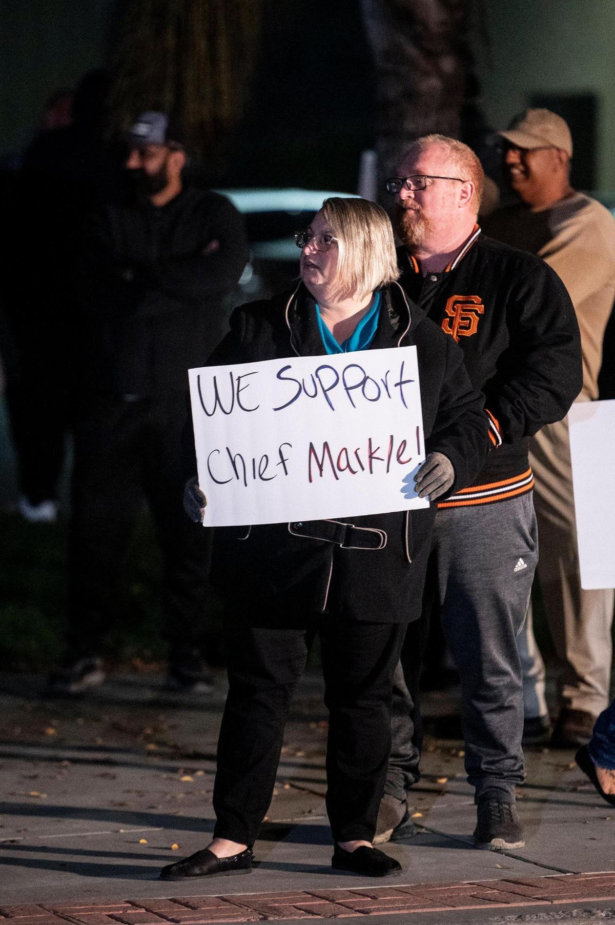 Theresa Land, 52, of Livingston, joins fellow residents in a call to action rally while demanding answers from elected officials outside Livingston City Hall in Livingston, Calif., on Thursday, Nov. 18, 2021. Livingston Police Chief John Markle, was recently placed on administrative leave by Interim City Manager Vanessa Portillo.