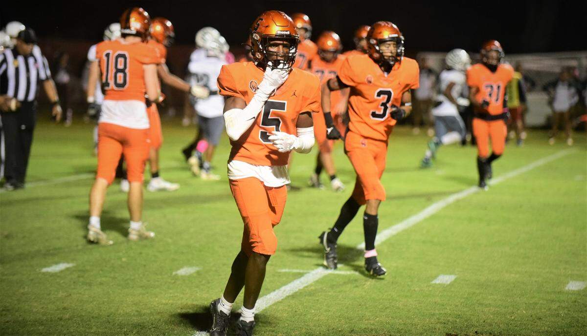 Merced High junior running back Chase Smith returns to the Bears sideline after scoring his four rushing touchdown during a 56-14 win over Central Valley on Friday, Oct. 21, 2022 at Cathie Hostetler Stadium at Merced High School.