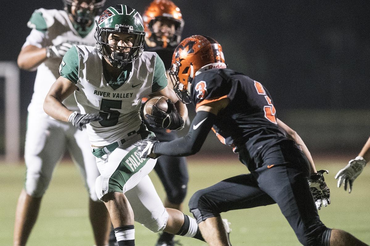 River Valley senior Evan Strickland (5) rushes the ball during a CIF Sac-Joaquin Section Division III playoff game against Merced at Veterans Stadium in Merced, Calif., on Friday, Nov. 9, 2018. The Falcons beat the Bears 45-40.