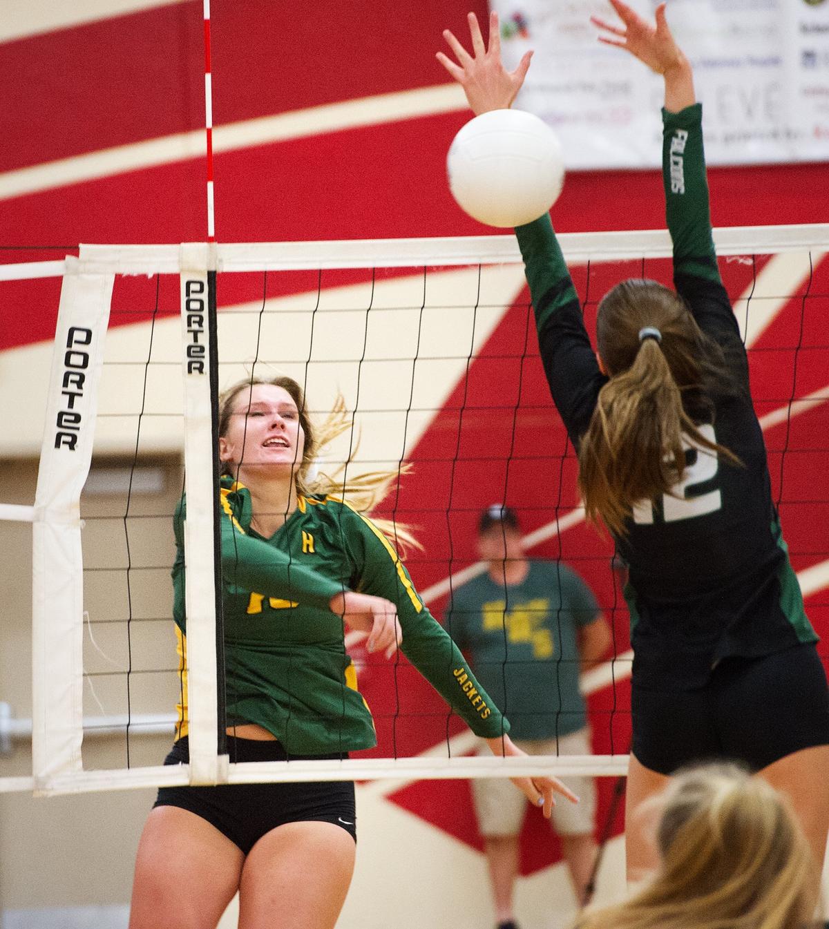 Hilmar’s Olivia Peterson spikes the ball past Colfax defender Mariah Vossoghi during the Div. IV Sac-Joaquin Section title game in Ripon, Calif., Saturday, Nov. 3, 2018.Hilmar won the match 3-0.