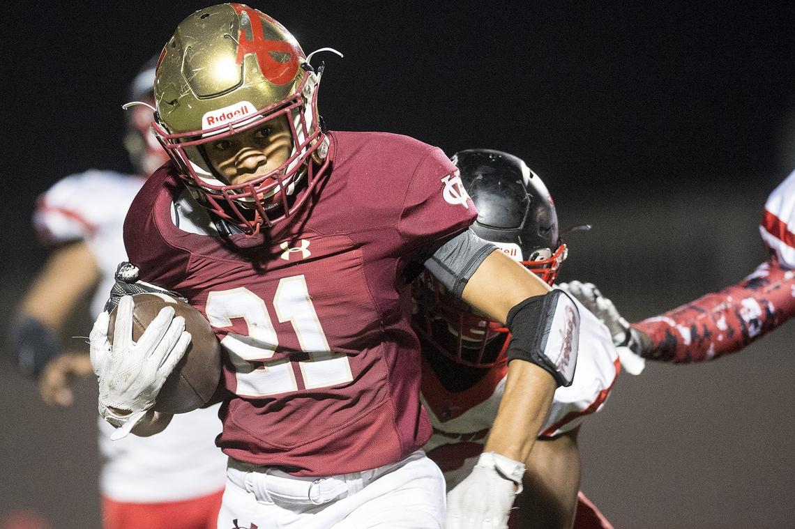Golden Valley junior Avery Townsel (21) rushes the ball during a game against Cordova in the CIF Sac-Joaquin Section Playoffs at Golden Valley High School in Merced, Calif., on Friday, Nov. 2, 2018.