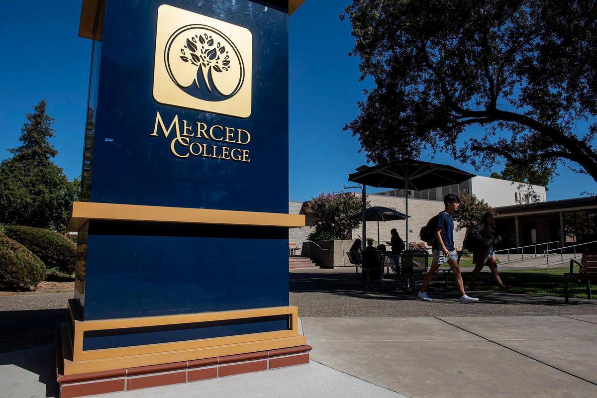 People walk across the campus of Merced College in Merced, Calif., on Thursday, Aug. 25, 2022.