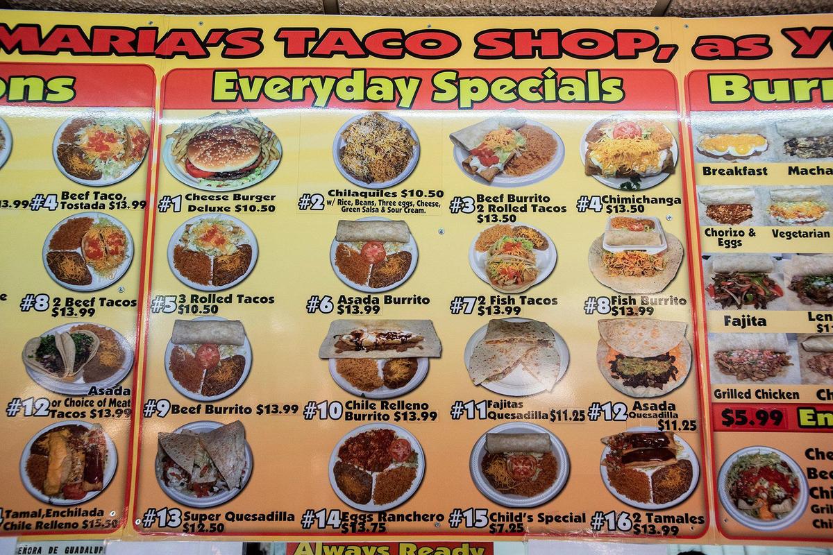 A sign lists various menu items available at Maria’s Taco Shop in Merced, Calif., on Tuesday, Oct. 15, 2024. The restaurant which is open 24 hours, has offered authentic fast Mexican food to the Merced community for 32 years.