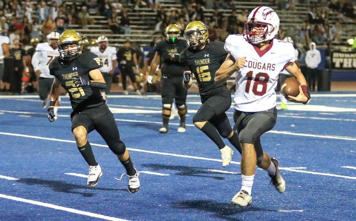 Golden Valley High quarterback Gabriel Richards (18) runs the ball up field during a football game against Buhach Colony on Friday, Oct. 11, 2024.