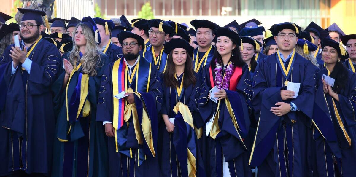 UC Merced graduate students look on during UC Merced’s 2023 spring commencement ceremony on Friday, May 12, 2023.