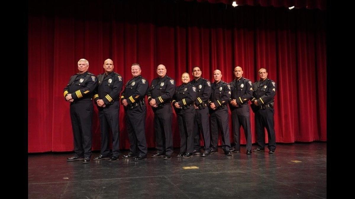 Merced Police Department officers pose for a photo at Golden Valley High School in Merced. A swearing in ceremony was held Tuesday for eight officers who received promotions. From left, Merced Police Chief Tom Cavallero, Capt. Joseph Weiss, Capt. Alan Ward, Lt. Daniel Dabney, Lt. Emily Foster, Lt. Joseph Perez, Sgt. Kalvin Haygood, Sgt. Jeremy Salyers and Sgt. Nathan Mckinnon. Image courtesy of Merced Police Department.