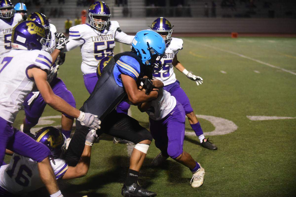 El Capitan High receiver Albert Simonian picks up some tough yards during a game against Livingston on Friday, Sept. 9, 2022.