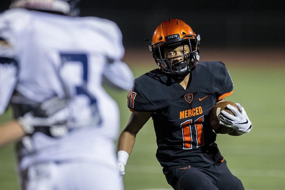Merced junior Desmond Thompson (11) rushes for a touchdown during a game against Gregori at Veterans Stadium on the campus of Golden Valley High School in Merced, Calif., on Friday, Aug. 24, 2018. The Bears beat the Jaguars 41-22.