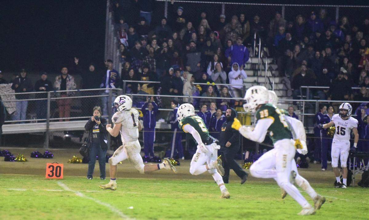 Escalon High senior running back Ryker Peters breaks free for a long touchdown run in the second half against Hilmar during a playoff game on Friday, Nov. 11, 2022, at McSweeney Field in Hilmar, Calif.