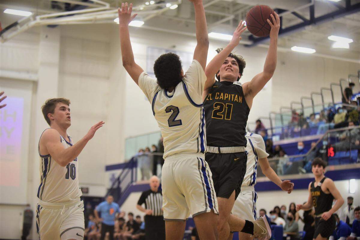 El Capitan High junior Will Bain goes up for a shot against Atwater’s Cameron Frazier during a game at Atwater High School on Friday, Feb. 4, 2022.
