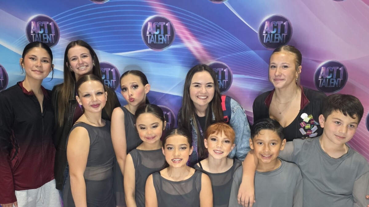 Teachers and students from Steps Dance Studio pose for a photo after a competition. The teachers are standing behind the students who are aged 5-12.