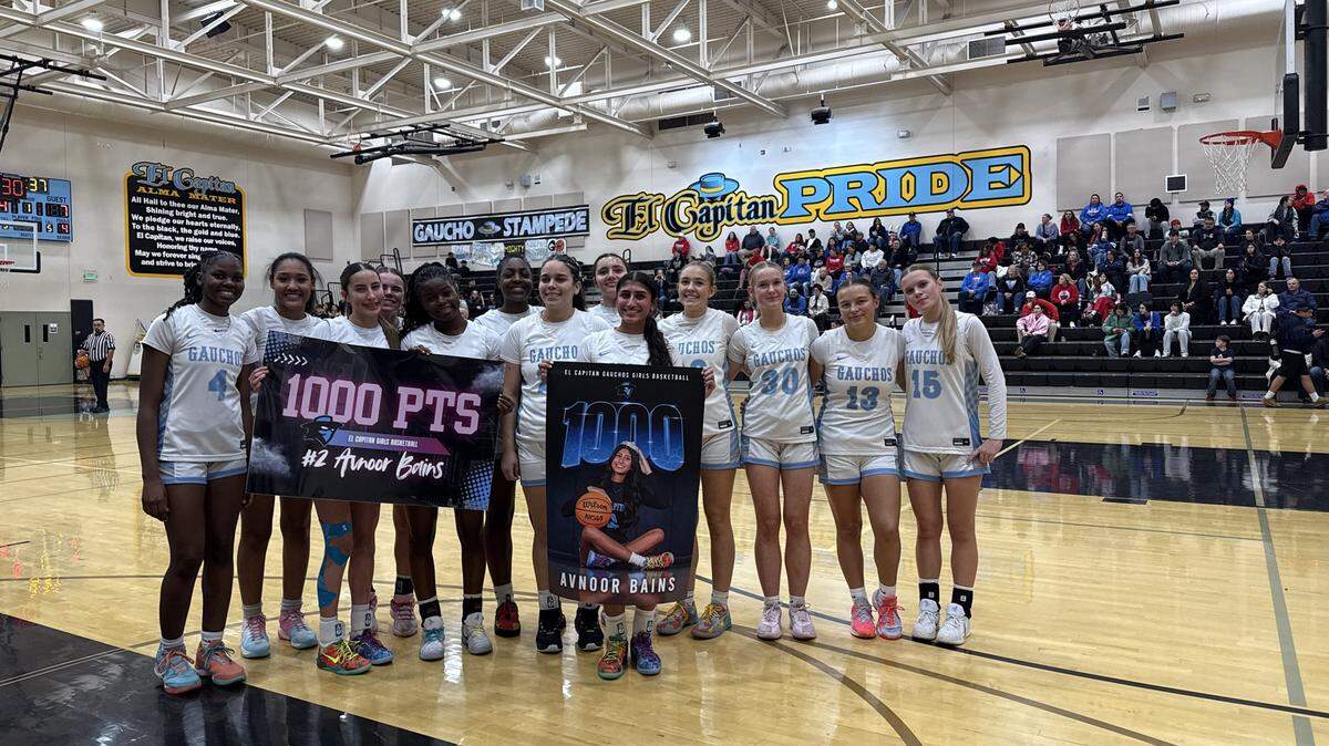 Senior Avnoor Bains and the El Capitan High girls basketball team celebrate her reaching 1,000 points in a win over Atwater on Tuesday, Jan. 20, 2026.