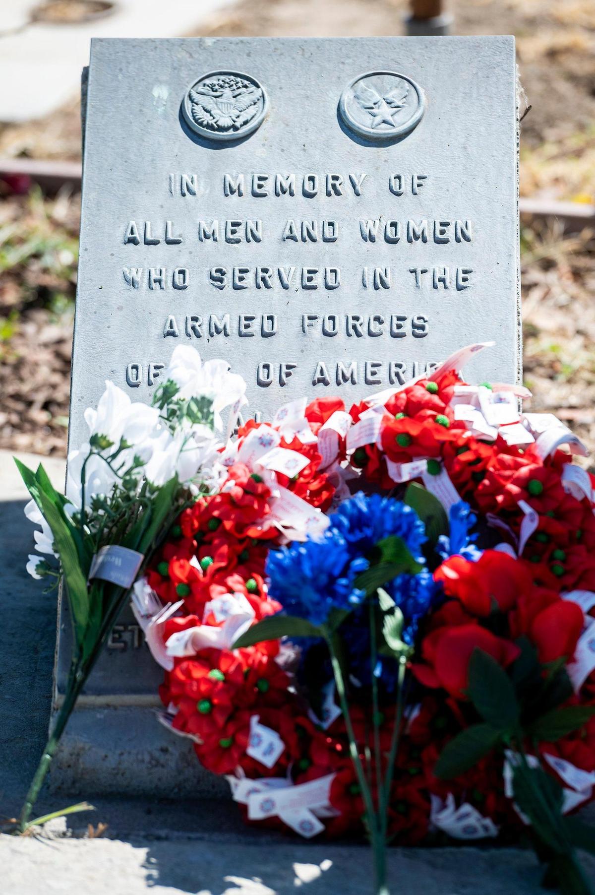 Flowers and a wreath are placed at a memorial for service members during a Memorial Day ceremony at the Los Banos Cemetery, located at 16575 Center Avenue in Los Banos, Calif., on Monday, May 30, 2022.