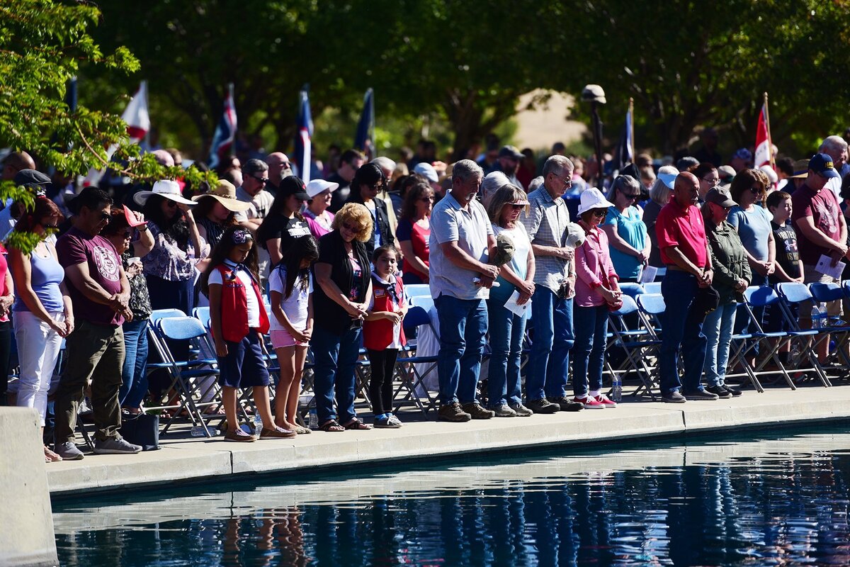 The crowd listens to a prayer on Sunday, May 27, 2018, at San Joaquin Valley National Cemetery in Santa Nella during a ceremony for Memorial Day.