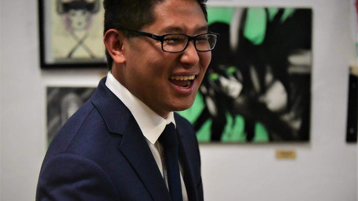 Merced City Council District 6 candidate Fue Xiong reacts after the initial election results shows a close race with incumbent Delray Shelton during a gathering of Xiong’s supporters at the Kreepy Kawaii Designs in Merced, Calif. on Tuesday, Nov. 8, 2022.