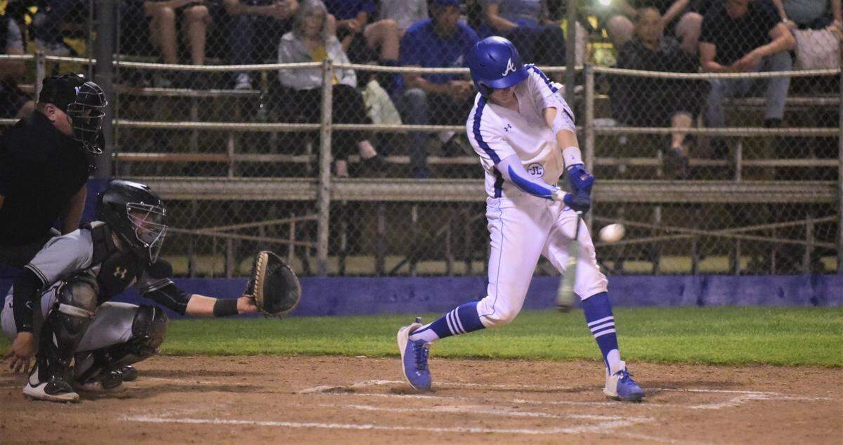 Atwater High senior Cole Hazel drives a single to right field to drive in a run during the third inning against Buhach Colony of during a game on Friday, March 26, 2022 at Memorial Ballpark in Atwater, Calif.