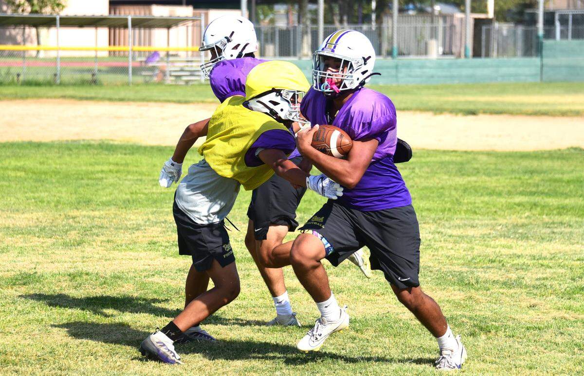Livingston High fullback Adrian Hernandez runs the ball during practice on Thursday, Aug. 1, 2024.