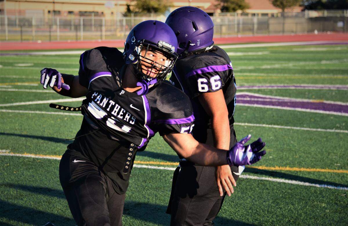 Pacheco High School junior Payton Mosley (55) participates in defensive drills during practice on Wednesday, Aug. 2, 2023 at Pacheco High School in Los Banos, Calif.