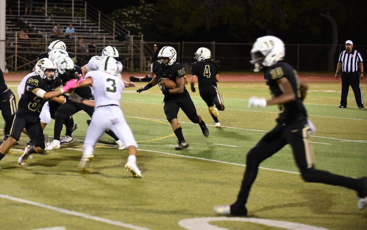 Buhach Colony running back Anthony Berry runs the ball against Tracy on Friday, Aug. 30, 2019. Berry finished with 110 yards and two touchdowns on the ground for the Thunder in a 35-21 win.